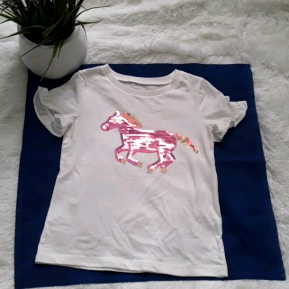 girl's white shirt with a horse design